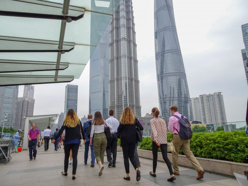 Interns walking through Lujiazui in Shanghai enroute to Citibank to understand how sector specific knowledge helps the company