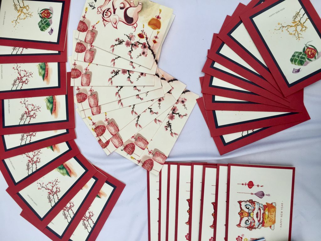 The Ho Chi Minh City Team arranges the cards to be sold at the Bazaar