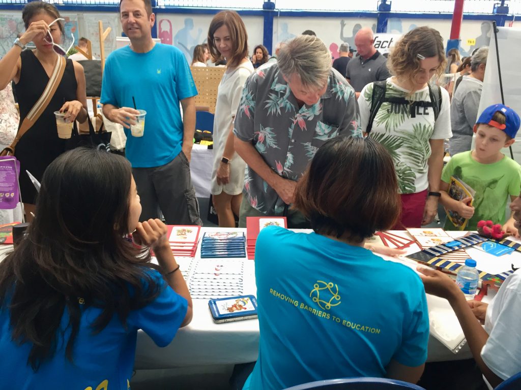 Guests at the Christmas Bazaar browse the fundraising stalls