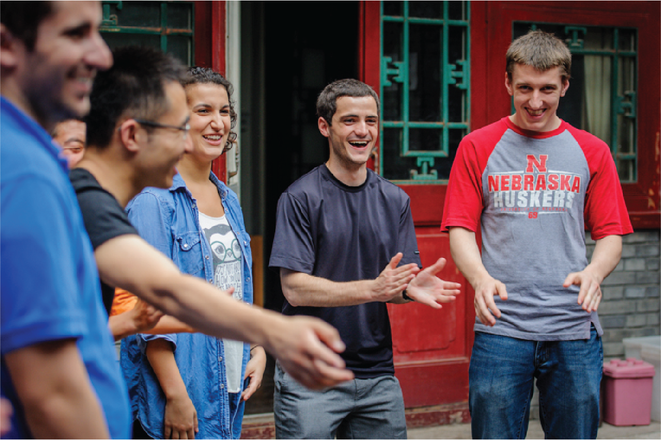 Short Term Programs Abroad student clapping and laughing