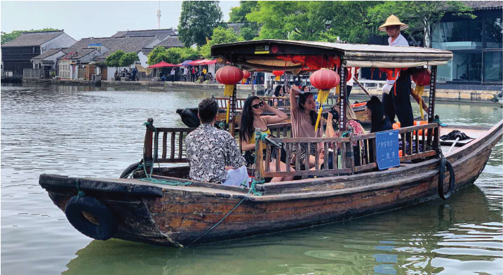 global internship program dates shanghai interns on a boat in zhujiajiao