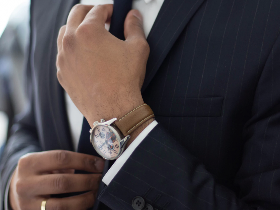 Man wearing tie preparing for interview